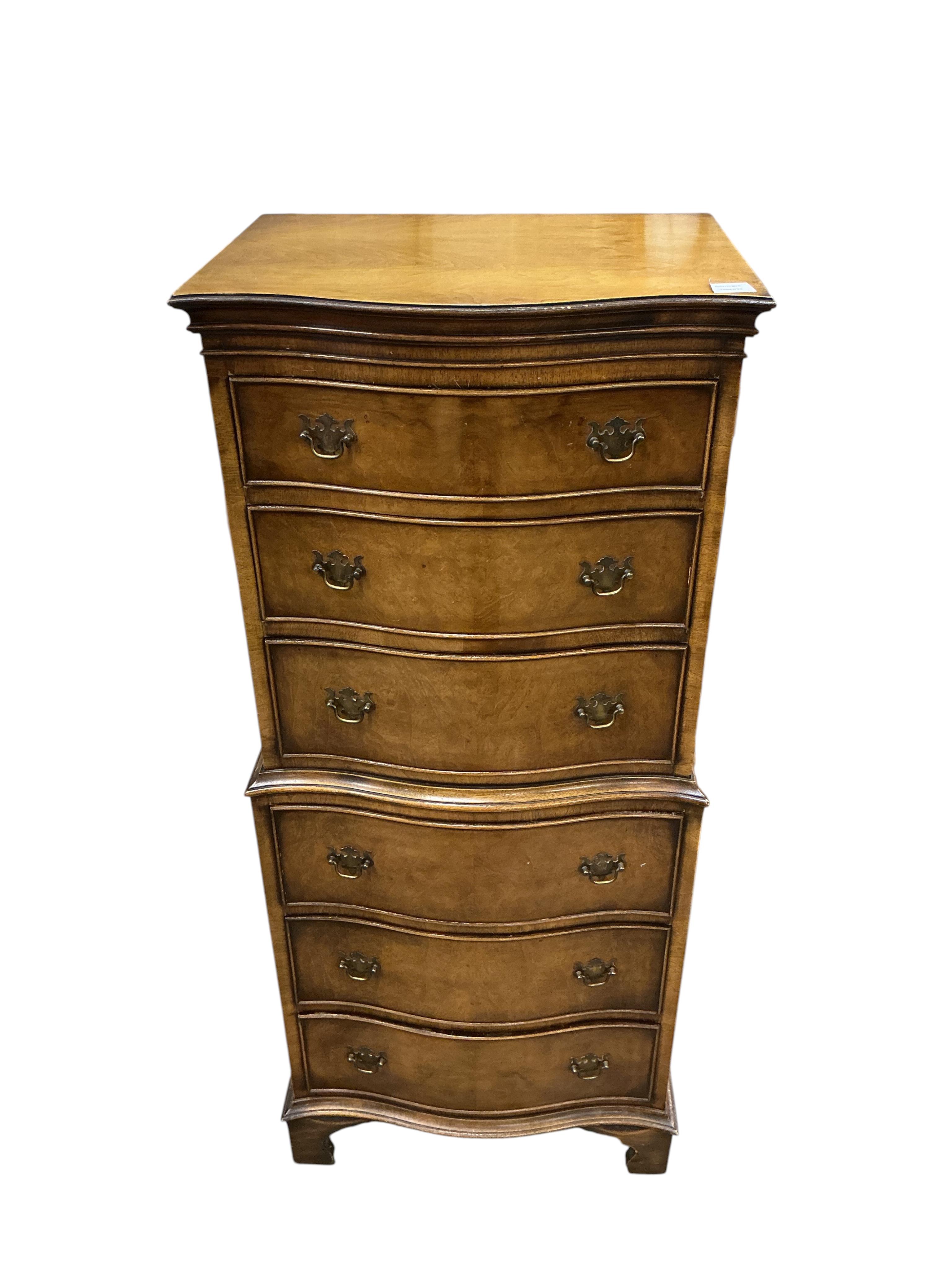 A reproduction George I style narrow walnut serpentine six drawer chest, width 55cm, depth 39cm, height 130cm